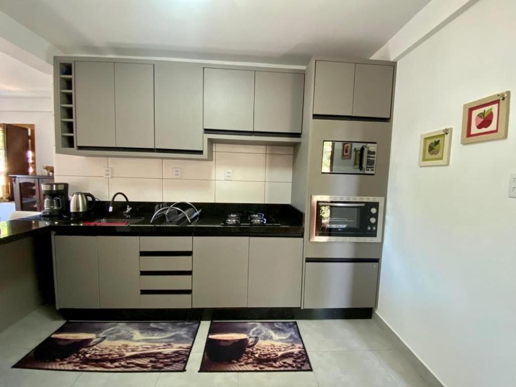 Kuchyň nebo kuchyňský kout v ubytování Villaggio dos Vinhedos