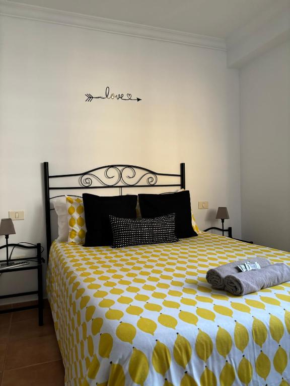 A bed or beds in a room at APARTAMENT SARDINA NEAR THE BEACH WITH POOL AND WIFI e