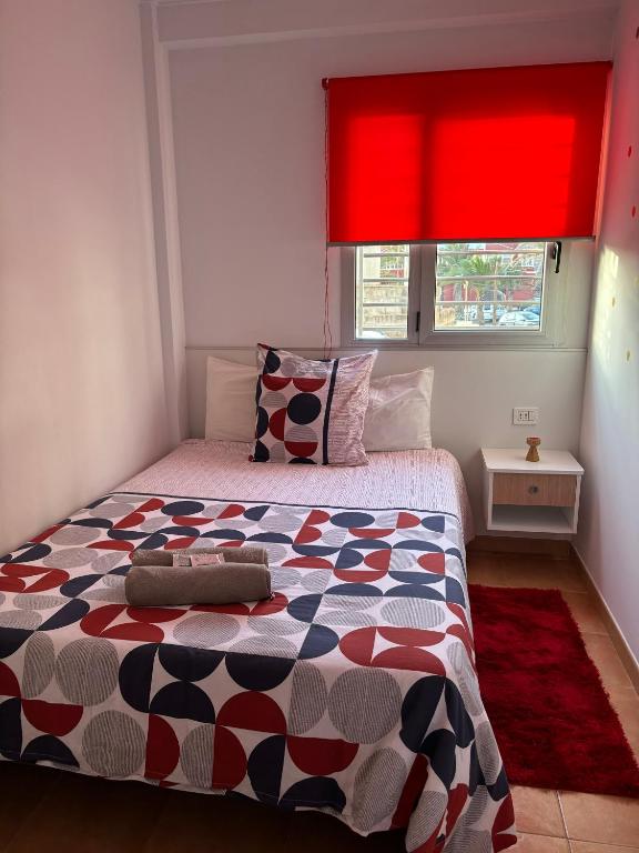 A bed or beds in a room at APARTAMENT SARDINA NEAR THE BEACH WITH POOL AND WIFI e