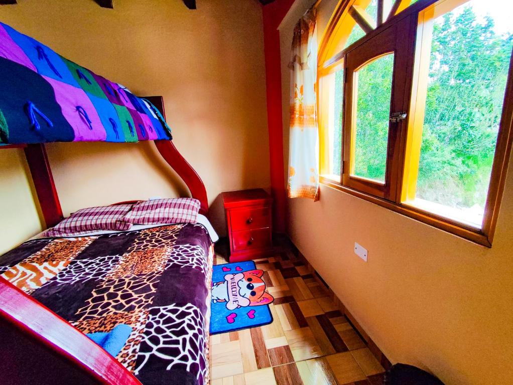 Postel nebo postele na pokoji v ubytování Hostal El Inca
