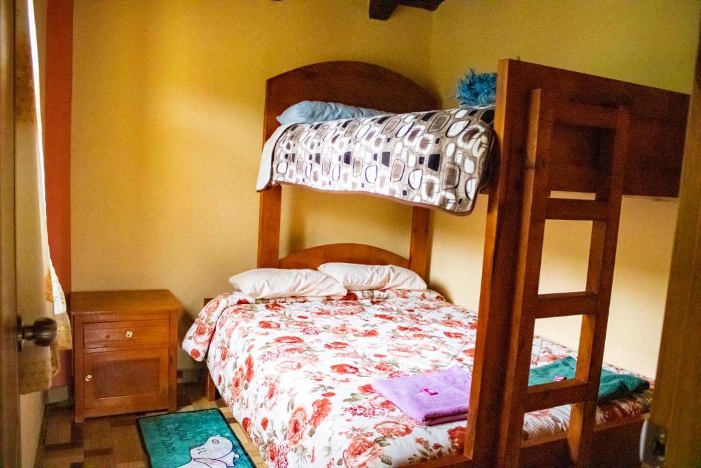 Postel nebo postele na pokoji v ubytování Hostal El Inca