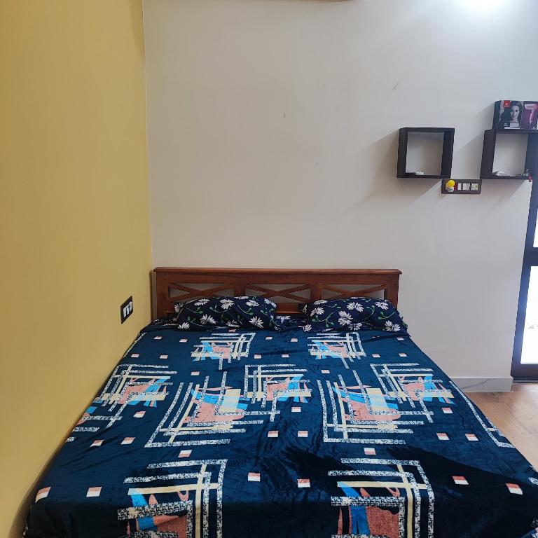 Postel nebo postele na pokoji v ubytování Maha Periyava Kuteeram