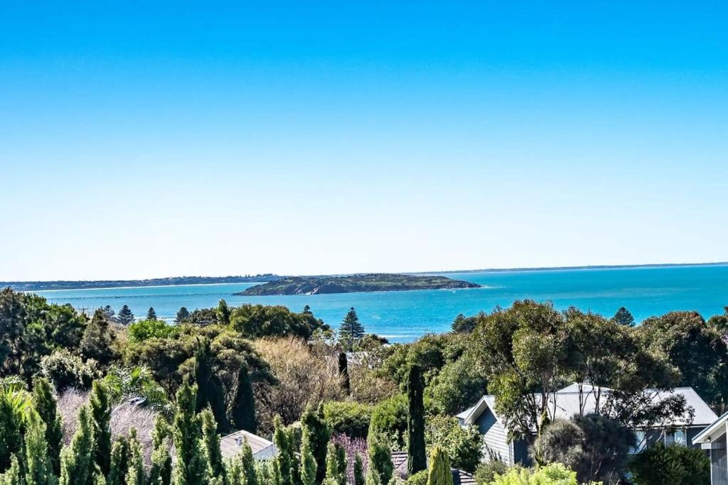a view of the ocean and houses and trees at 8 Davies St Encounter Bay - No Linen Included - Wi-Fi - Sea Views in Encounter Bay