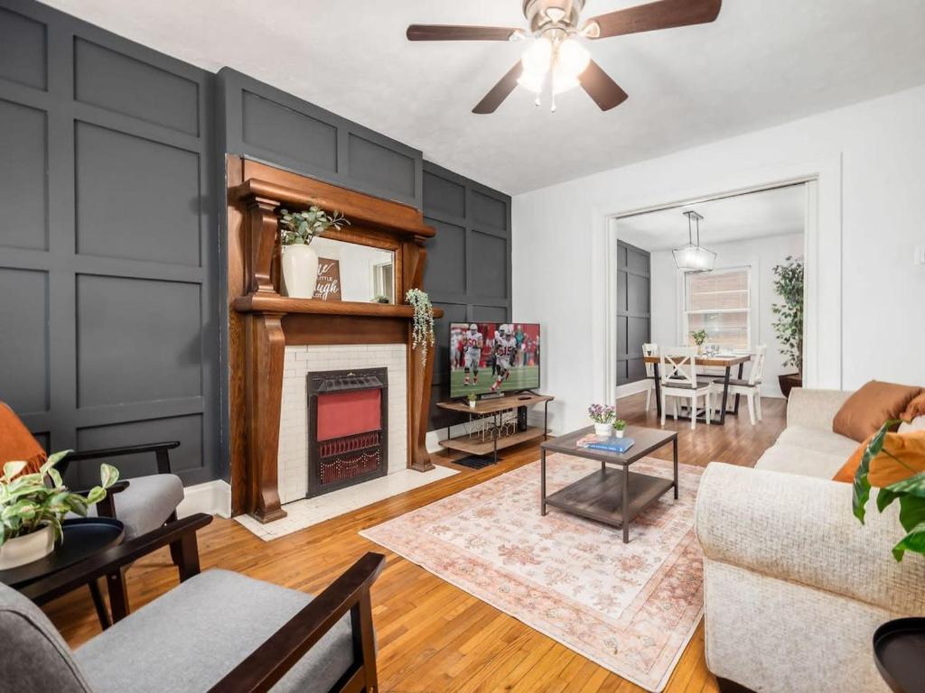 a living room with a couch and a fireplace at Housepitality - The Cobblestone 2- New Renovation in Columbus
