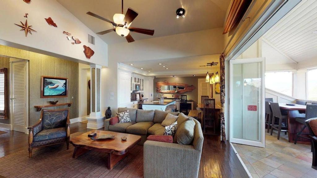 a living room with a couch and a table at C300 Custom 4 bedroom Ocean View Penthouse in Koloa