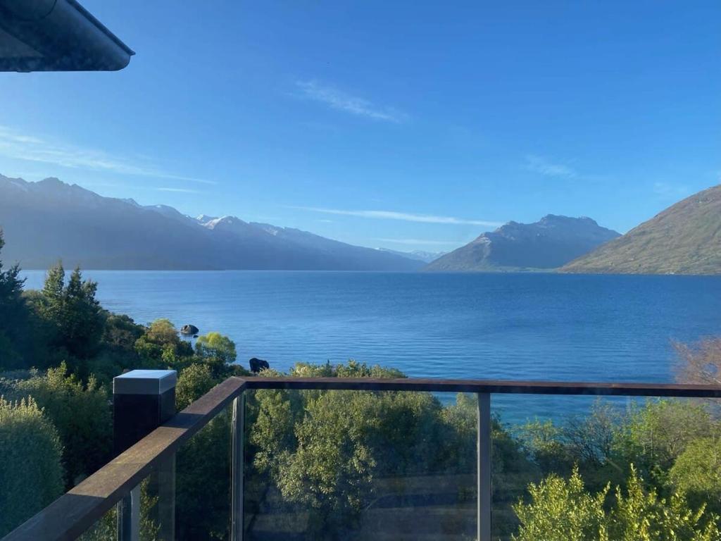 a view of a lake from a balcony at Private Retreat - Stunning Lake & Mountain Views in Queenstown