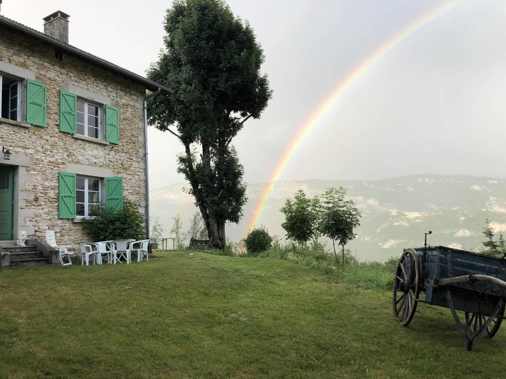 a rainbow in front of a house with a cannon at Maison Rencurel, 8 pièces, 15 personnes - FR-1-548-44 in Rencurel