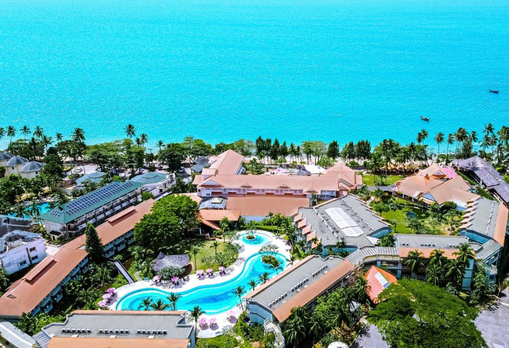 an aerial view of a resort with a pool and the ocean at Aonang Villa Resort I Beach Front in Ao Nang Beach