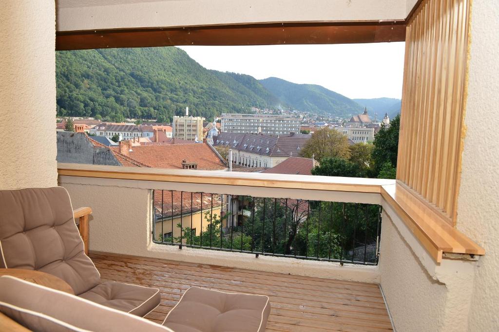 a balcony with a view of a city at Top View Apartaments in Braşov