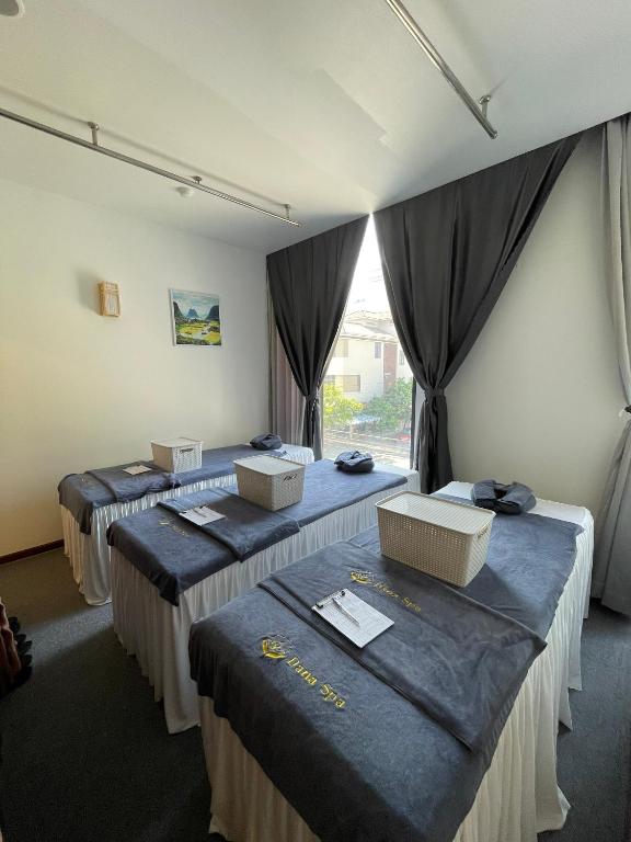 Postel nebo postele na pokoji v ubytování Danaciti Hotel
