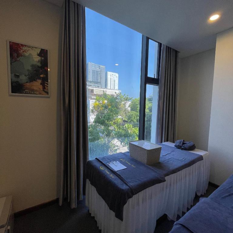 Postel nebo postele na pokoji v ubytování Danaciti Hotel