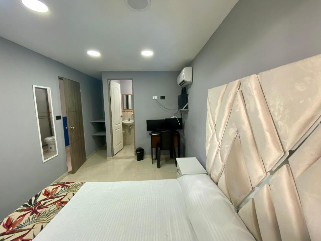 Una cama o camas en una habitación de Casa Mango