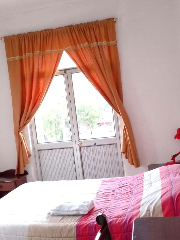 Postel nebo postele na pokoji v ubytování Hostal Almagro
