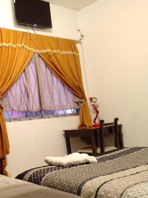 Postel nebo postele na pokoji v ubytování Hostal Almagro