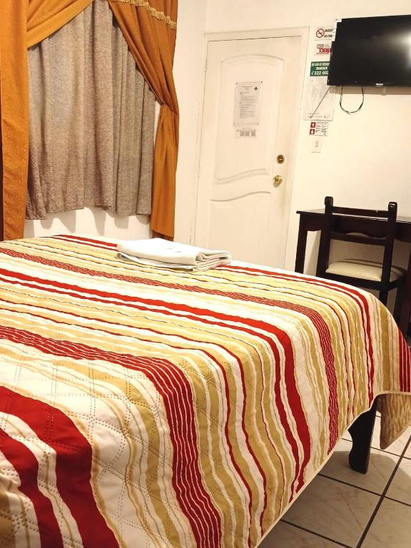 Postel nebo postele na pokoji v ubytování Hostal Almagro