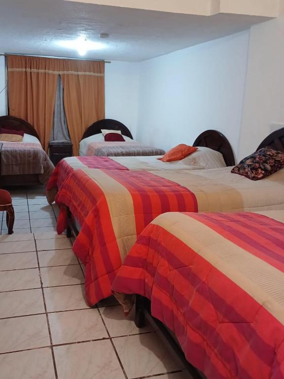 Postel nebo postele na pokoji v ubytování Hostal Almagro