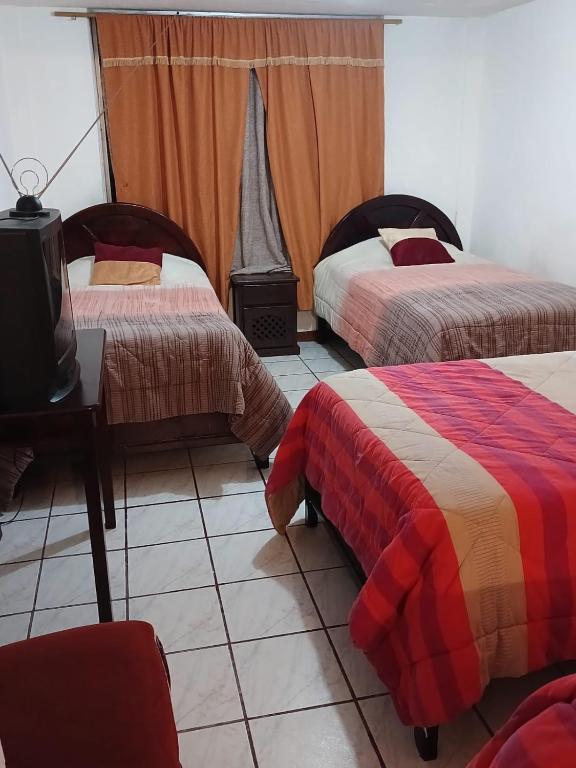 Postel nebo postele na pokoji v ubytování Hostal Almagro