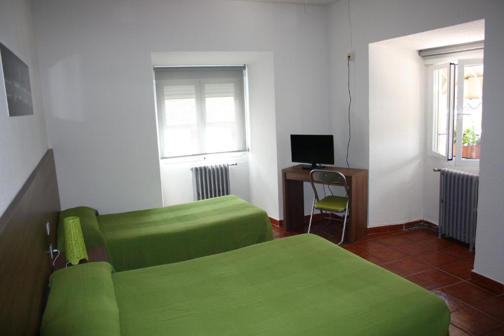 TV a/nebo společenská místnost v ubytování Hostal La Estación
