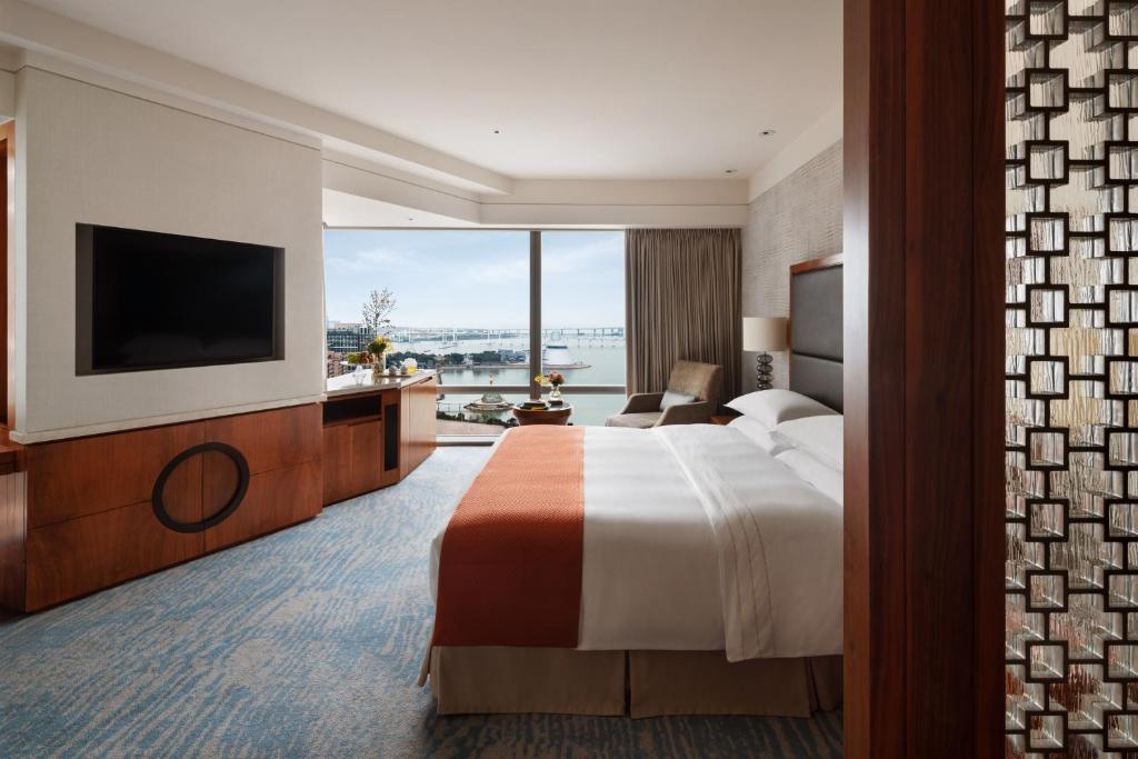 Postel nebo postele na pokoji v ubytování Mandarin Oriental, Macau