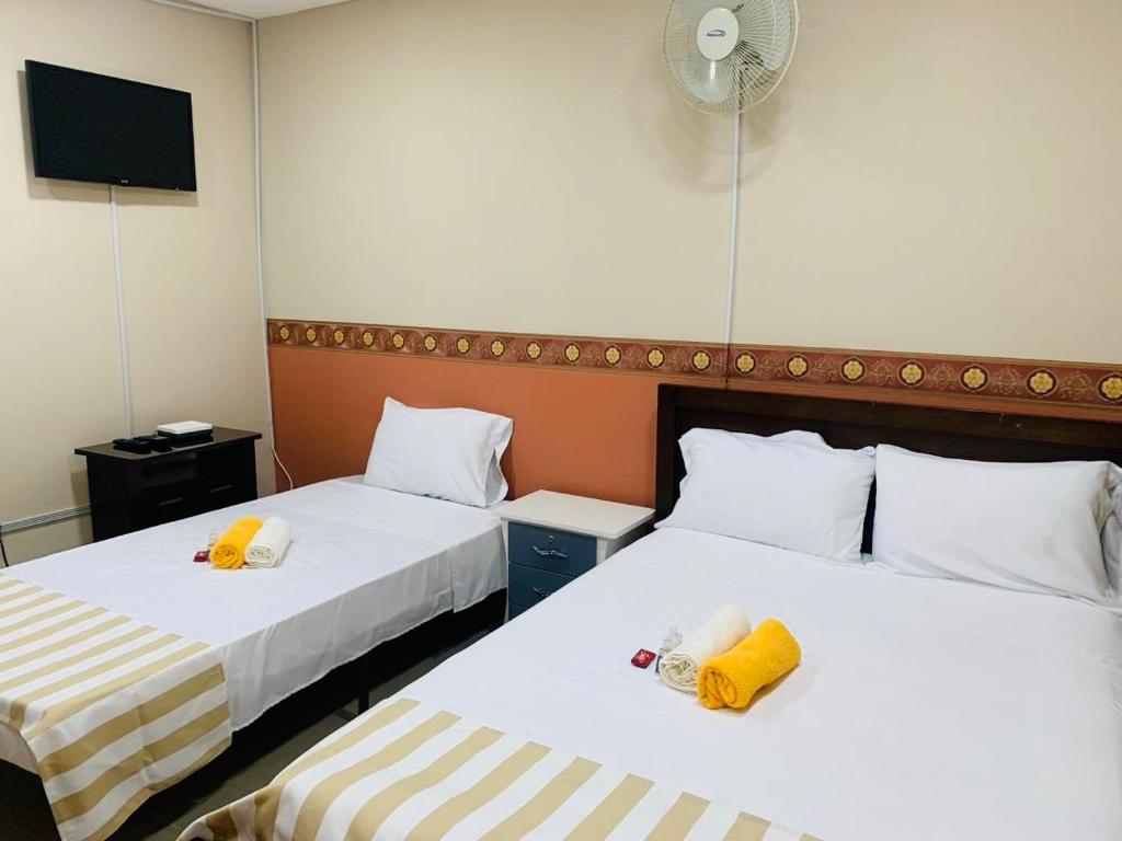 Una cama o camas en una habitación de Casa Mango