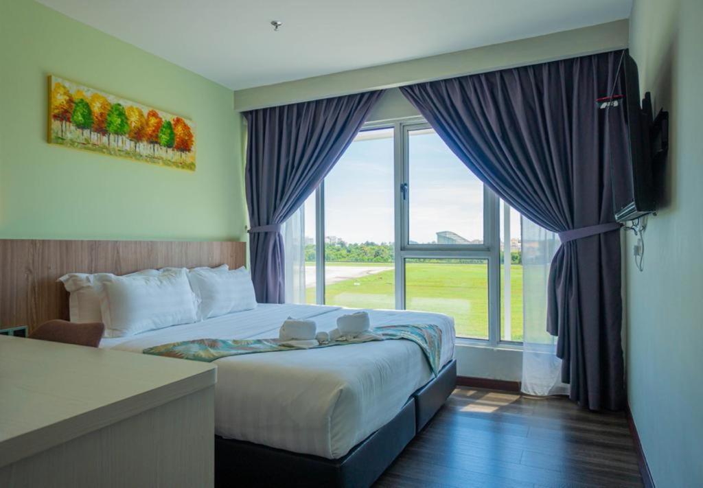 Postel nebo postele na pokoji v ubytování FLYPOD Hotel