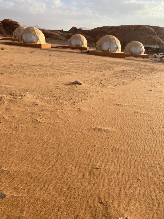 a group of domes in the desert at Moon Rum Camp in Wadi Rum