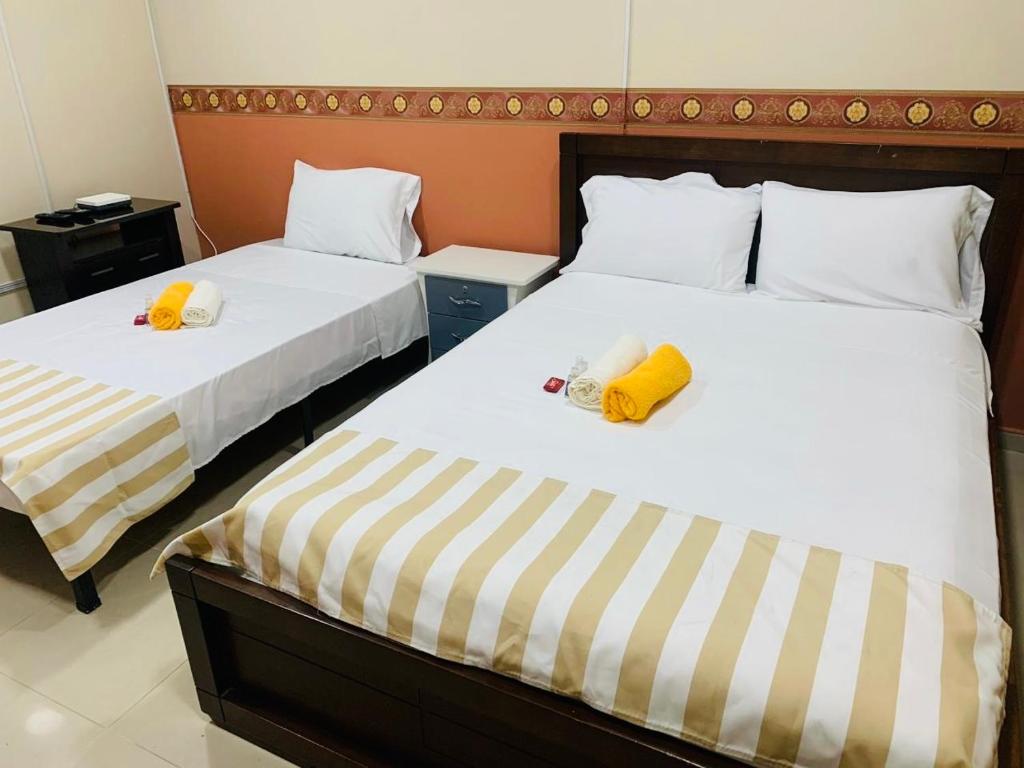 Una cama o camas en una habitación de Casa Mango