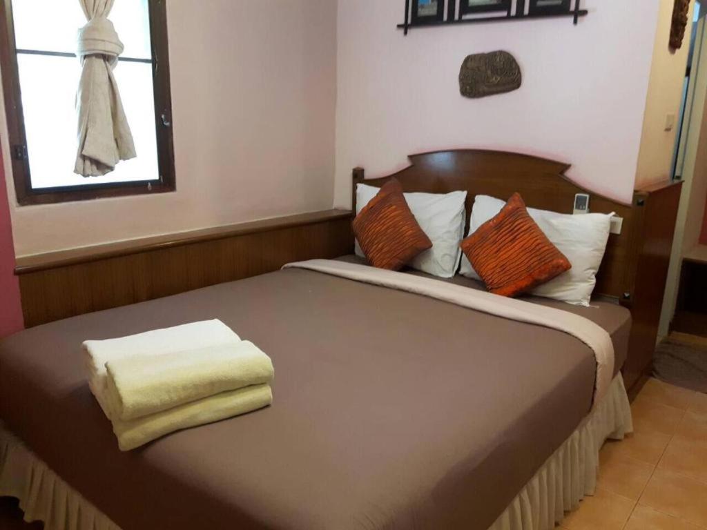 Un ou plusieurs lits dans un hébergement de l'établissement Salad Beach Resort - SHA Extra Plus