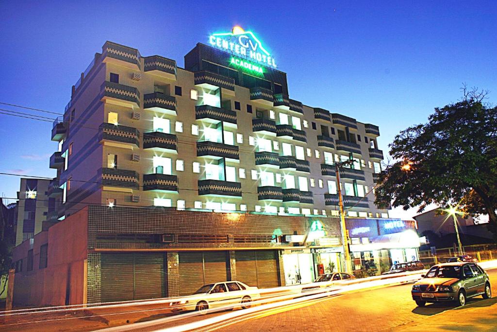 a large building with a sign on top of it at Rede Andrade GV Center Hotel in Governador Valadares