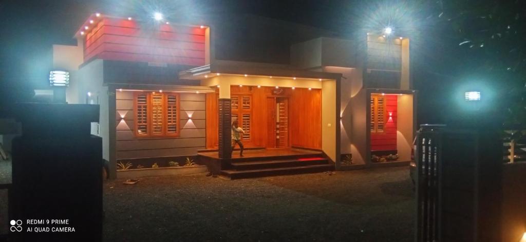 a building at night with lights on it at Le Serene in Meenangadi