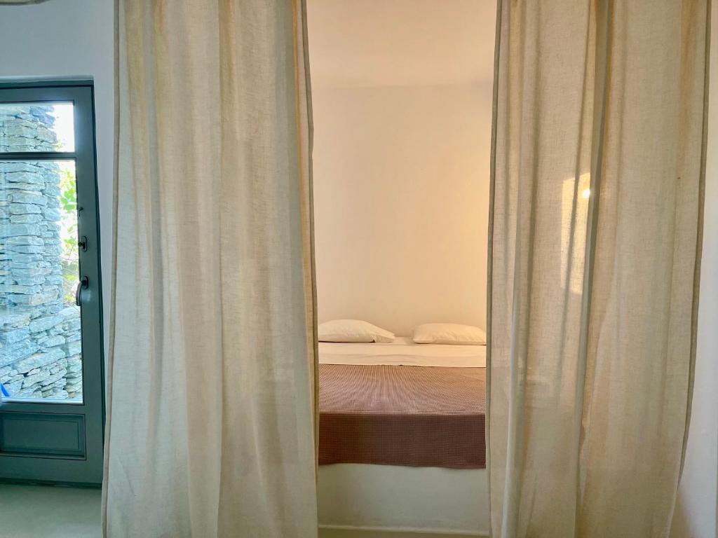 Postel nebo postele na pokoji v ubytování AEGEAN WINGS MAISONETTE