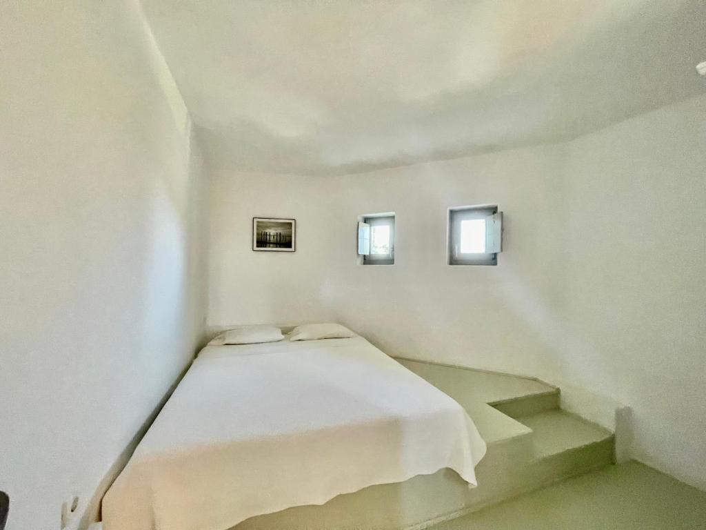 Postel nebo postele na pokoji v ubytování AEGEAN WINGS MAISONETTE