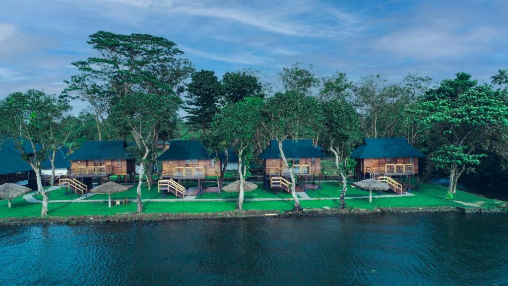 an aerial view of a resort with trees and water at Water Scapes in Kumarakom