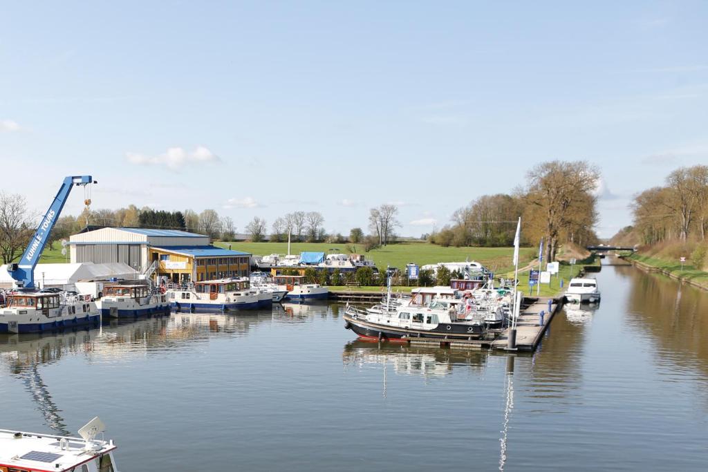 a group of boats are docked at a marina at Kuhnle-Tours Niderviller Apartments in Niderviller