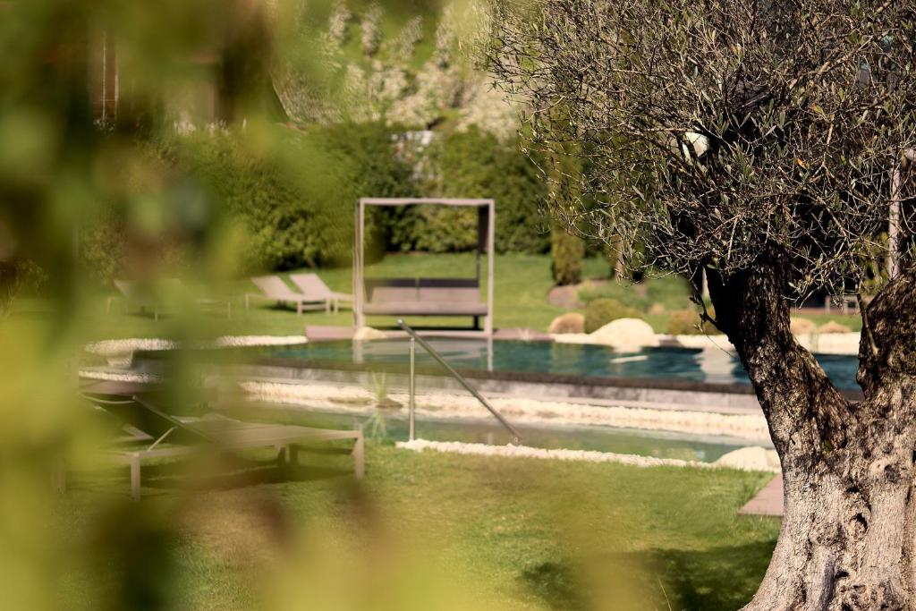 a swimming pool with a goal in the water at Klein Fein Hotel Anderlahn in Parcines