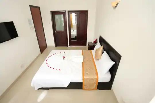 Ένα ή περισσότερα κρεβάτια σε δωμάτιο στο Queen Hotel NT - by BAY LUXURY