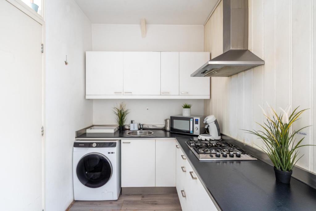 Kuchyň nebo kuchyňský kout v ubytování Penthouse Amsterdam Dam Square