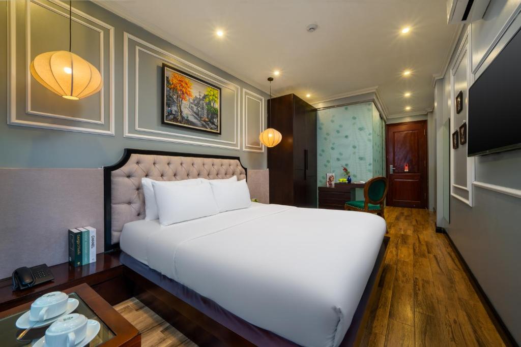 Postel nebo postele na pokoji v ubytování Bella Rosa Hotel & Travel