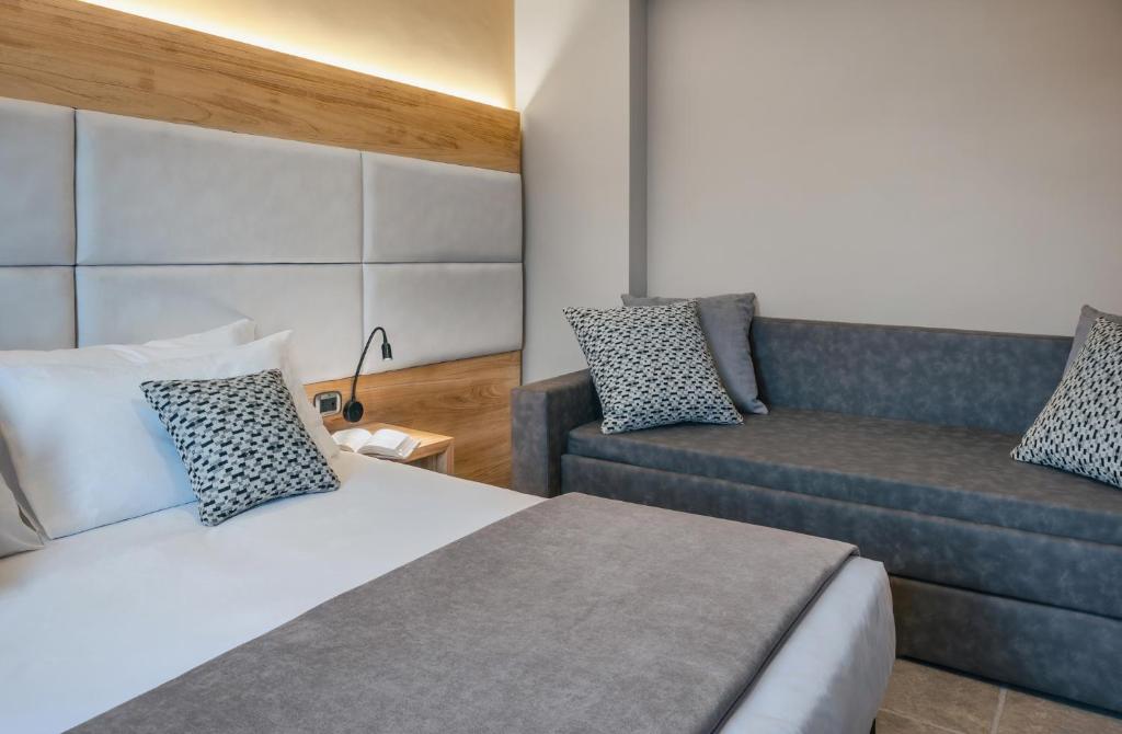 Un pat sau paturi într-o cameră la Hotel La Fenice