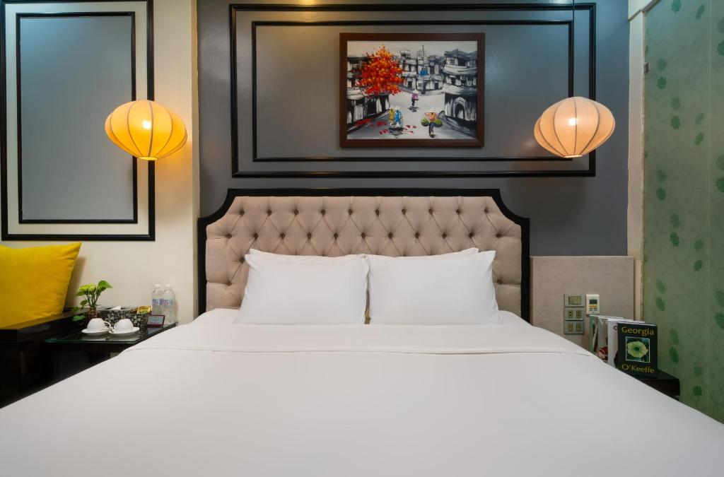 Postel nebo postele na pokoji v ubytování Bella Rosa Hotel & Travel