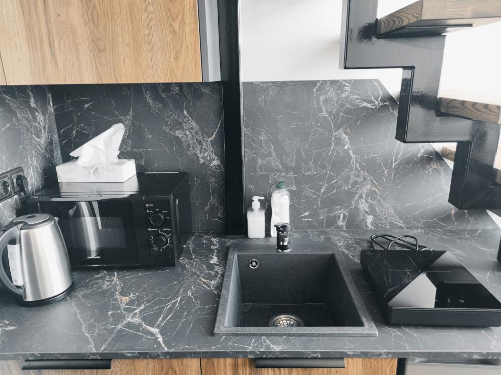 Η κουζίνα ή μικρή κουζίνα στο Eva Loft