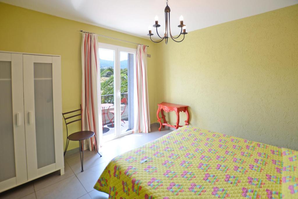 Postel nebo postele na pokoji v ubytování Hôtel la Palma