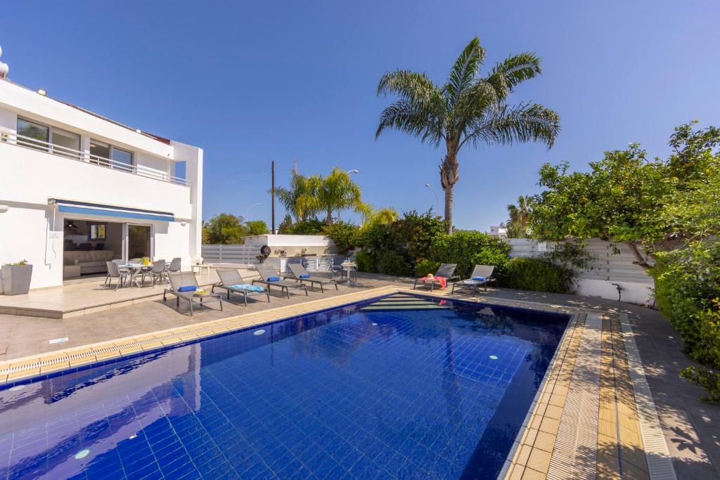 a swimming pool in the backyard of a house at Azure Luxury Pool Villa in Protaras