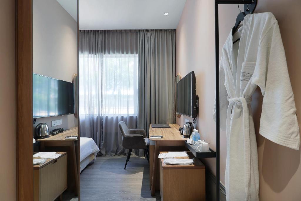 TV a/nebo společenská místnost v ubytování The Jesselton Hotel