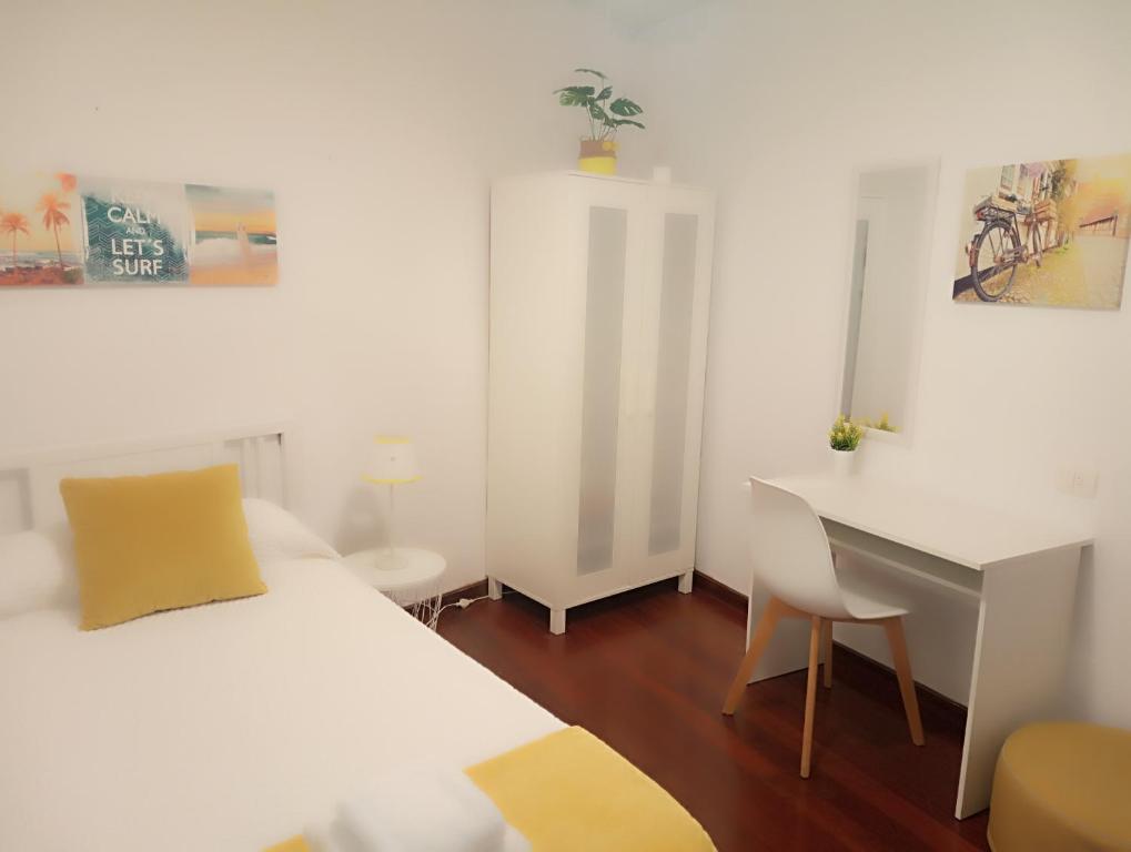 Posteľ alebo postele v izbe v ubytovaní CASA AMELIA Apartamento Bajo con terraza y jardín Apartamento 1ªPlanta