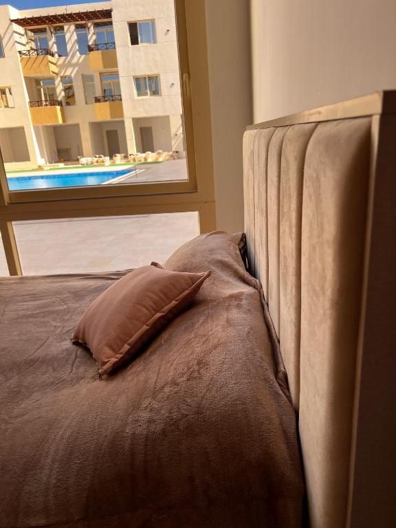 Postel nebo postele na pokoji v ubytování Port Ghalib Apartments
