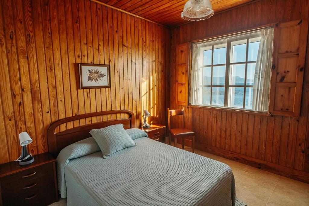 Posteľ alebo postele v izbe v ubytovaní Apartamentos Ancoradoiro