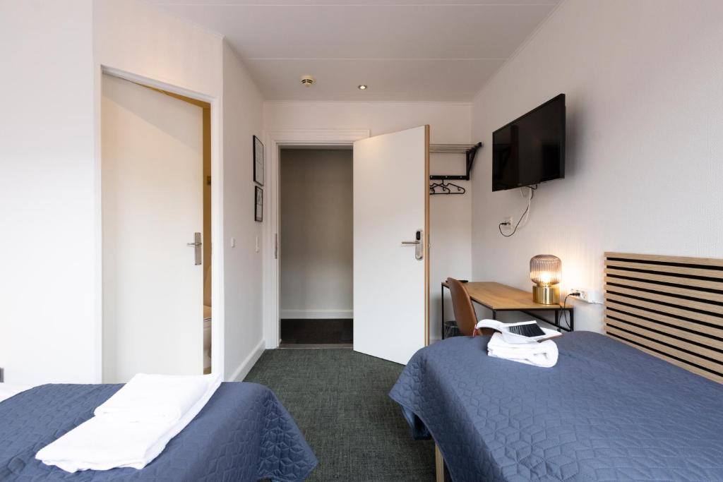 Postel nebo postele na pokoji v ubytování Milling Hotel Mini 11