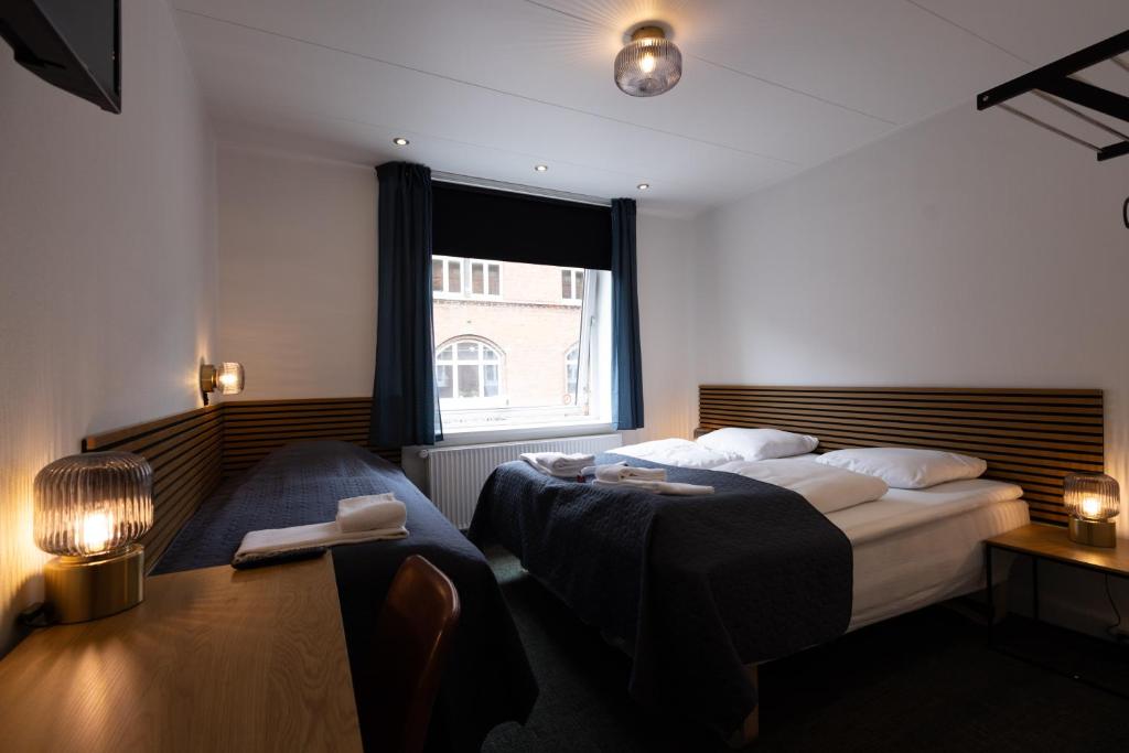 Postel nebo postele na pokoji v ubytování Milling Hotel Mini 11