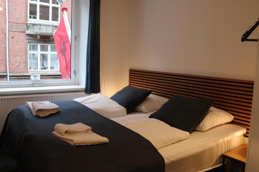 Postel nebo postele na pokoji v ubytování Milling Hotel Mini 11